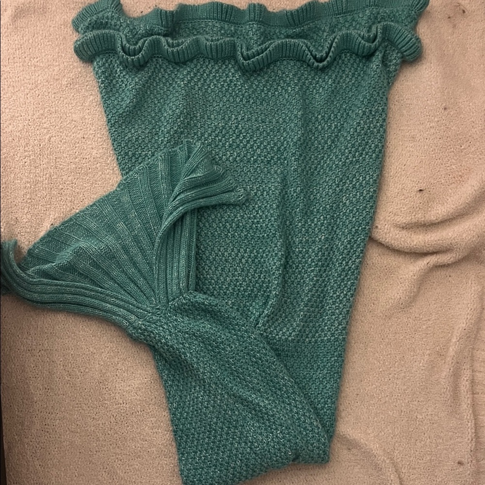 Teal crocheted mermaid tail blanket